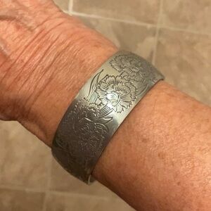 Vintage pewter cuff bracelet with an intricate raised flower design. Excellent!